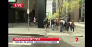 Thumbnail for The absolute state of Australia. Man nearly gets arrested for carrying a protest sign and telling everyone that families are starving. Doughnut eating copper couldn’t catch him though