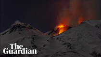 Thumbnail for Snow-covered Mount Etna spews lava and ash as it erupts | Guardian News