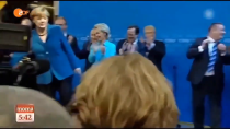 Thumbnail for Angela Merkel disgusted by German Flag - Throws it away at Victory Celebration of own Party
