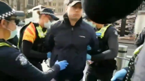 Thumbnail for State of Australia. Man arrested for standing in the street.