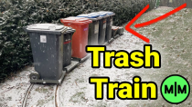 Thumbnail for I put my trash cans on rails and now they move automaticaly! (Trash Train) | Max Maker