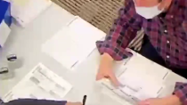 Thumbnail for Woman inside polling area has been filling out BLANK BALLOTS for over an hour, and stamping them, with a uniformed officer standing right there.