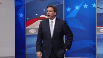 Thumbnail for Ron DeSantis says those holding Nazi flags with DeSantis 2024 signs ‘not true supporters' of his ... | WMUR-TV