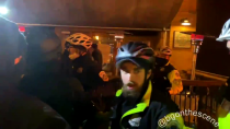 Thumbnail for Washington, DC: Police push #antifa back as they gather around diners during their street march.