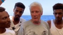 Thumbnail for Pedollywood millionaire Richard Gere boards migrant ship stuck in the Mediterranean and actively encourage illegal migration to Europe.