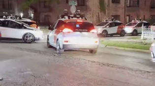 Thumbnail for Self driving cars in Austin meet in an intersection to discuss the future of SkyNet.