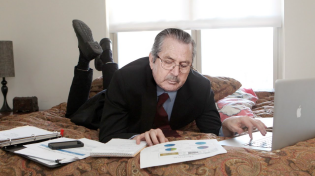 Thumbnail for Businessman Does His Work Lying On Bed Like Schoolgirl | The Onion
