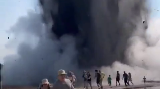 Thumbnail for Ground explodes at Yellowstone taking a boardwalk with it.  People running for their lives.