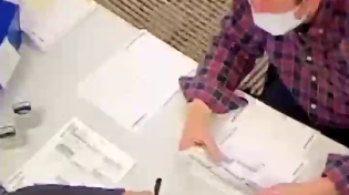 Thumbnail for Woman inside polling area has been filling out BLANK BALLOTS for over an hour, and stamping them, with a uniformed officer standing right there.