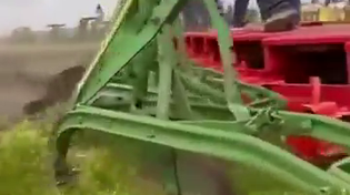 Thumbnail for A restored 1905 Case 150 steam tractor, the largest ever built by Case, pulling 44 John Deere plows.  