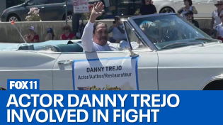 Thumbnail for Someone throws waterballoon at Danny Trejo at parade. Danny Trejo & his friend gets out of car and tries to act tough. Trejo then gets reminded that his 80 year old ass is old.