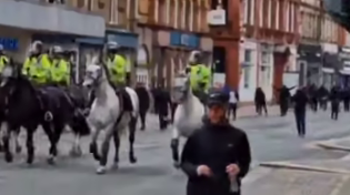 Thumbnail for UK police leads muslim crowd to attack white citizens