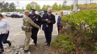 Thumbnail for UK soldier arrests police officer for murder of children back up saves him and they laugh and grin at the prospect of dead children