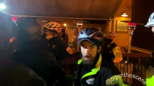 Thumbnail for Washington, DC: Police push #antifa back as they gather around diners during their street march.
