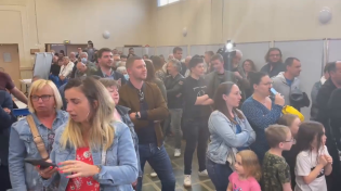 Thumbnail for General frustration in a Marine Le Pen supporter meetup. Two men on the right side of the video do not seem too disappointed with the results.